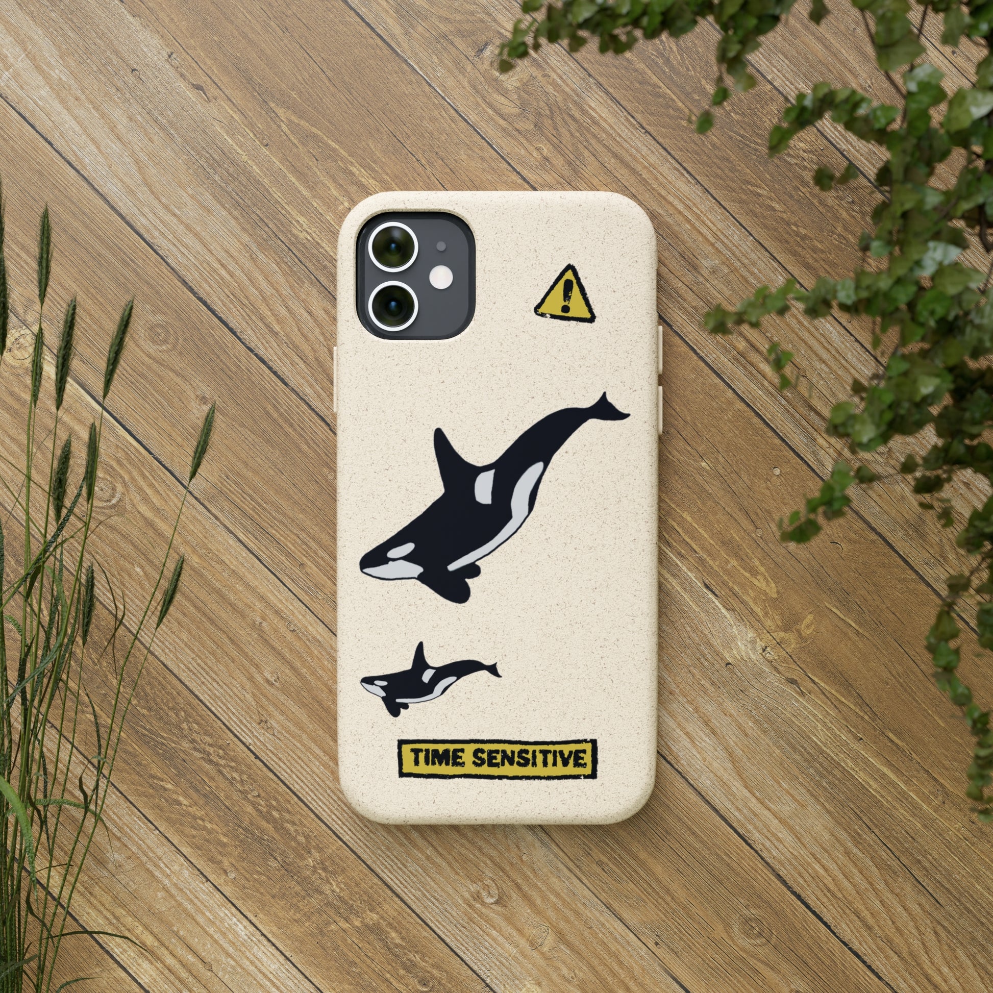 The back of The Orca Whale Phone Case, Tan, The artwork displayed is two Orca Whales swimming.